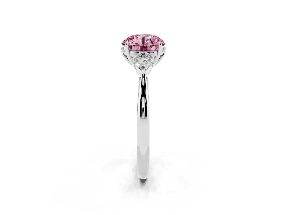 Fancy Pink Three-Stone Round Cut Diamond Ring with Pear Side Stones in Four-Prong Setting Platinum