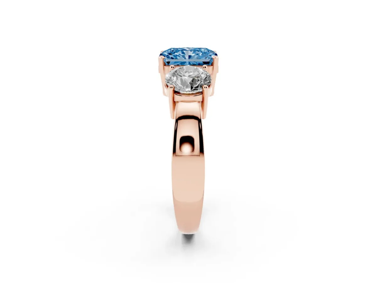 Fancy Blue Three-Stone Radiant Cut Diamond Ring with Round Side Stones, Classic Band, and Four-Prong Setting Rose gold