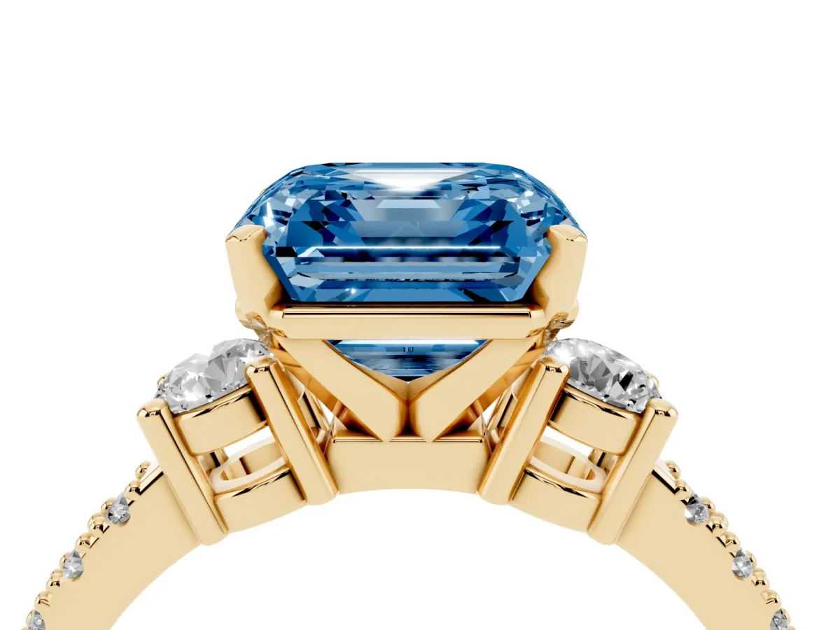 Fancy Blue Asscher Cut Three-Stone Diamond Pavé Band with Prong Setting Yellow gold