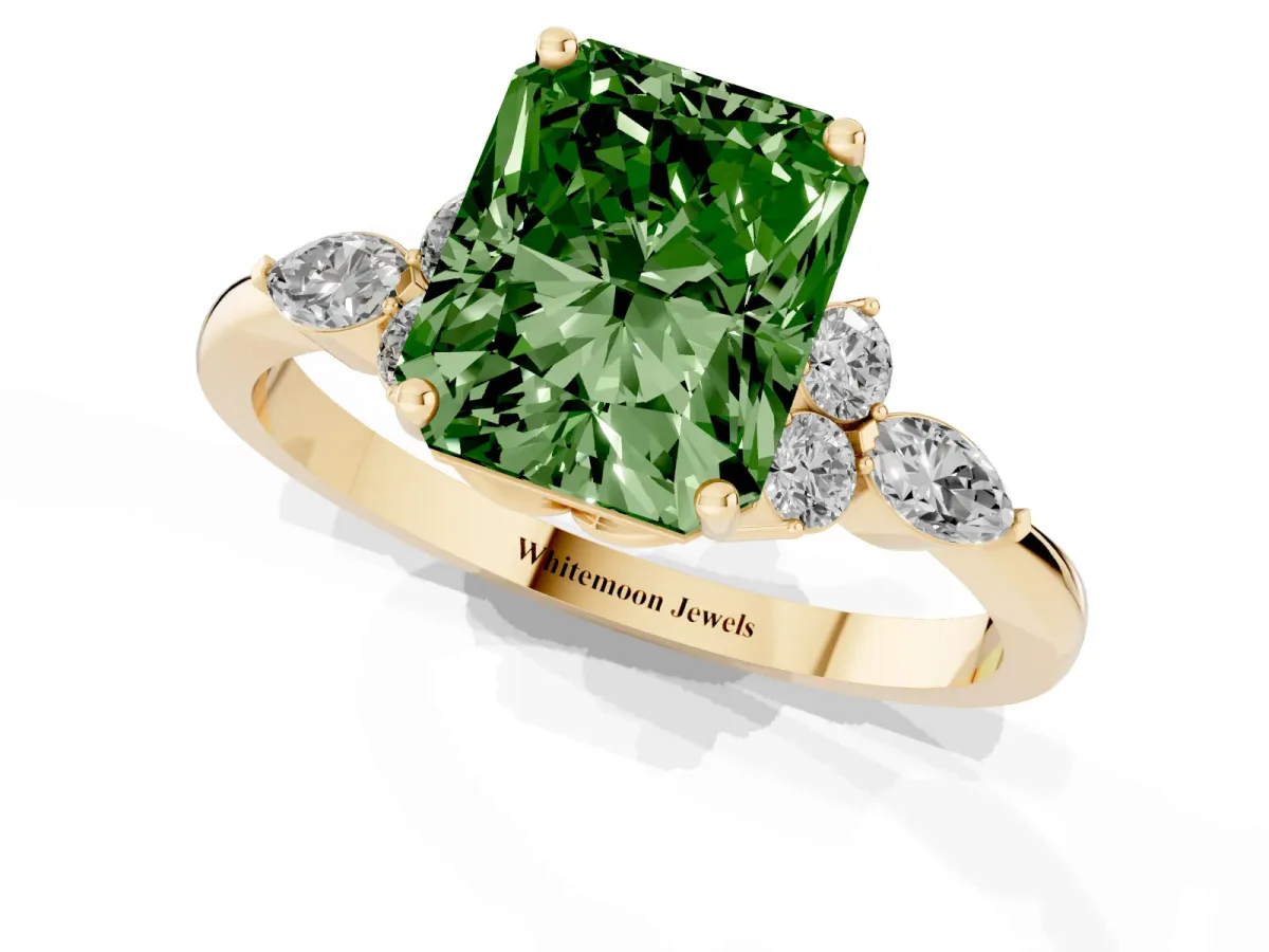 Fancy Green Radiant Cut Brilliant Diamond Solitaire Ring with Pear Side Stones and Four-Prong Setting Yellow gold