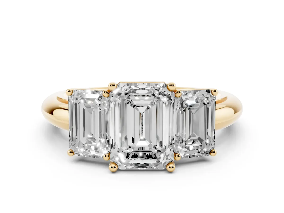 Three-Stone Emerald Cut Cut Diamond Engagement Ring with Prong Setting on a White Gold Band Yellow gold