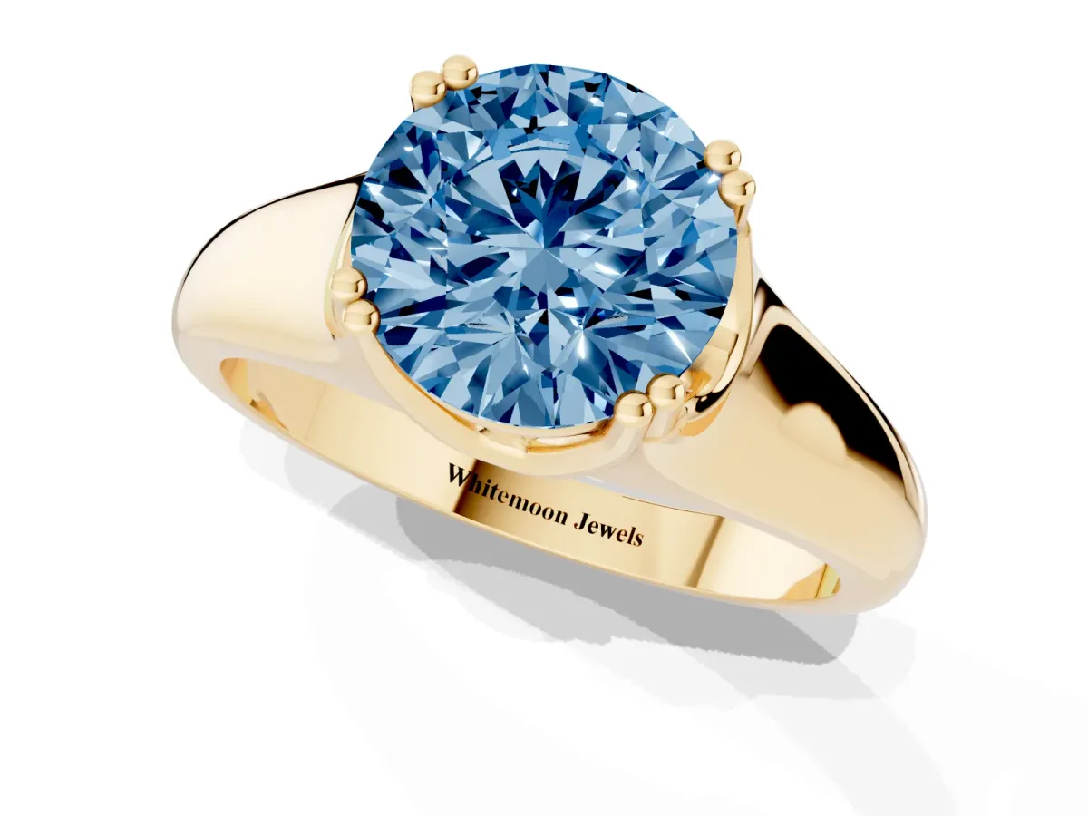 Fancy Blue Round Cut Diamond Solitaire Ring with Wide Band and Prong Setting Yellow gold