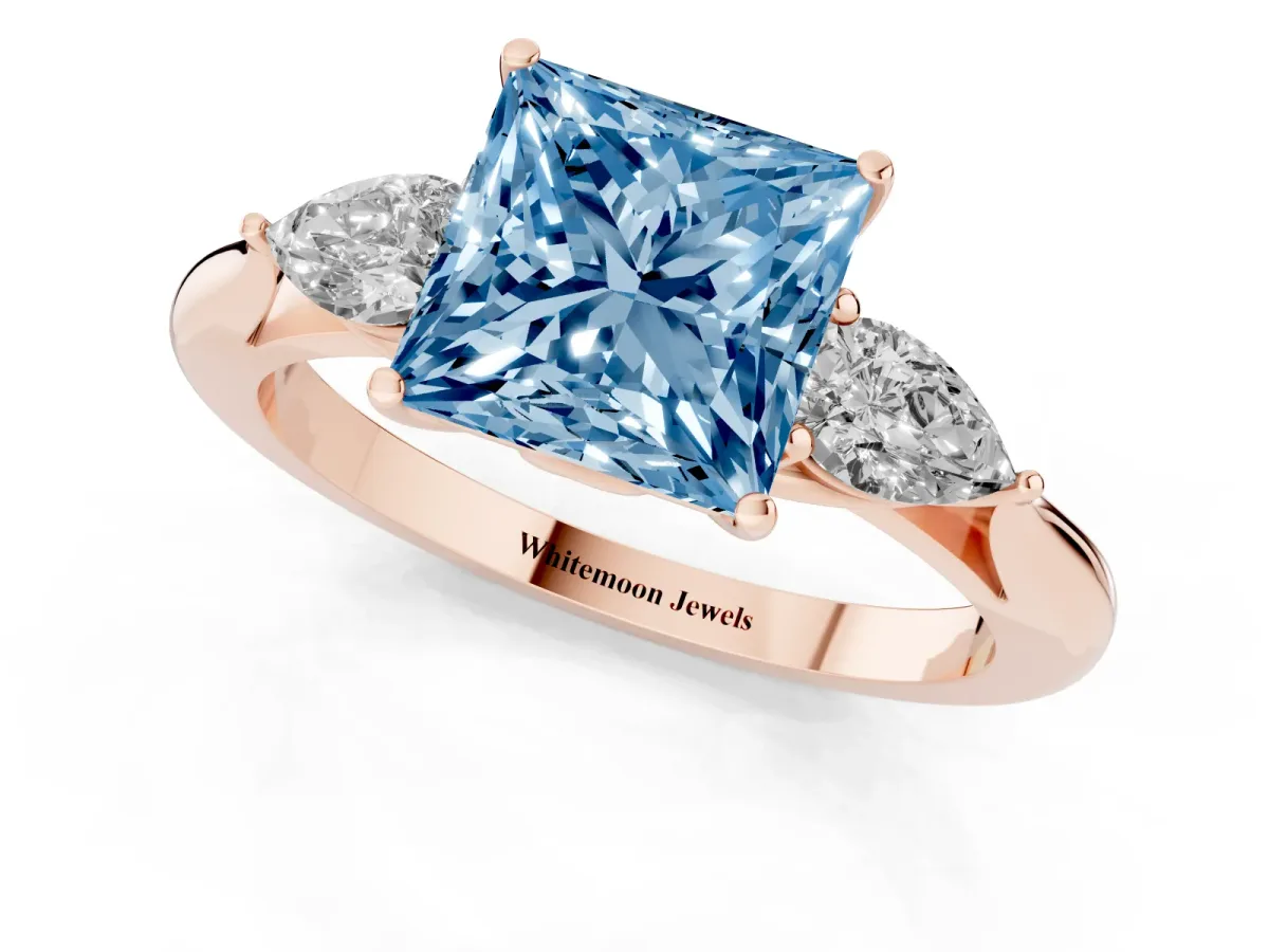 Fancy Blue Three-Stone Princess Cut Diamond Ring with Pear Side Stones in Four-Prong Setting Rose gold