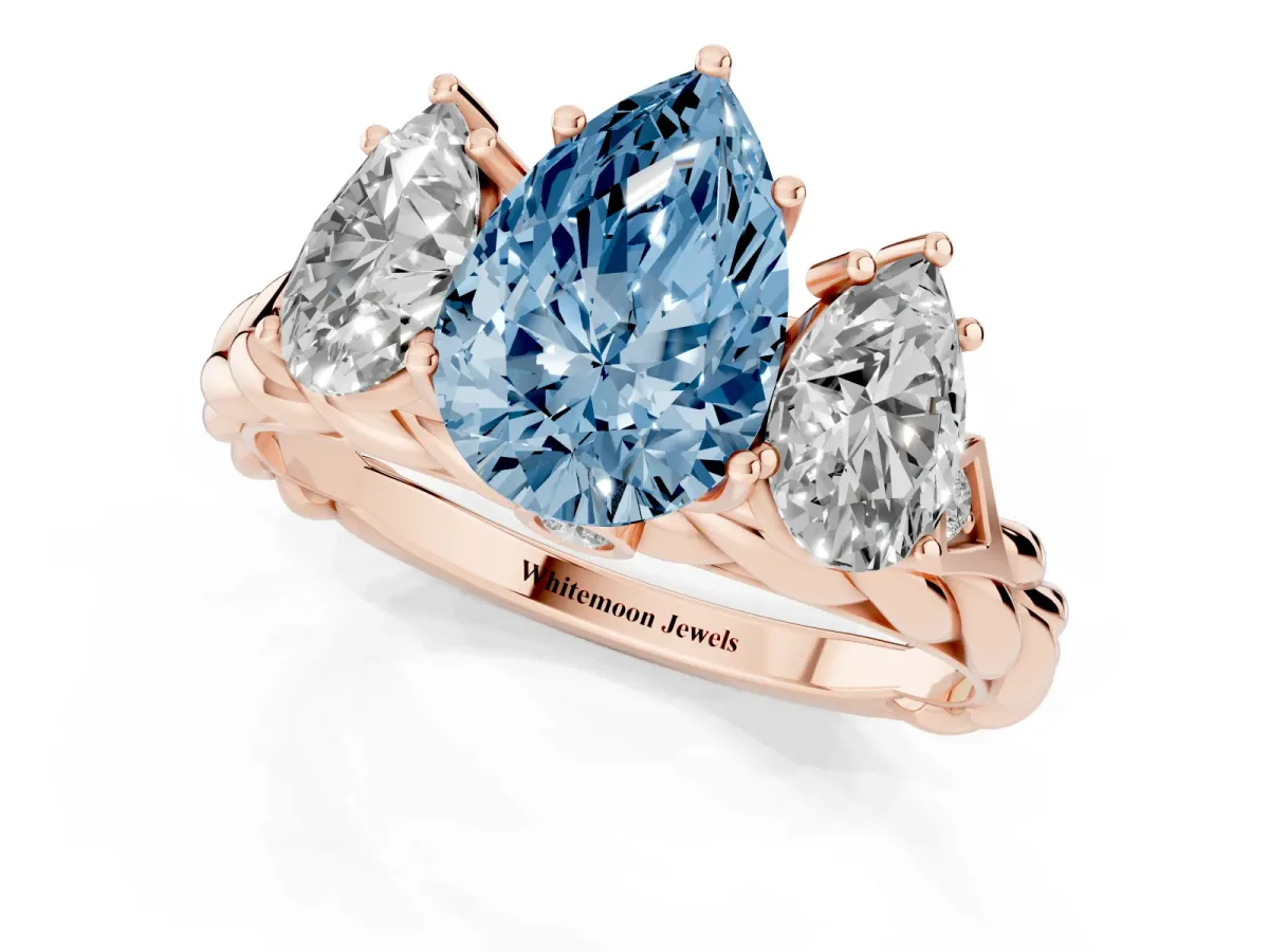 Fancy Blue Three-Stone Pear Cut Diamond Braided Band Ring with Four-Prong Setting Rose gold