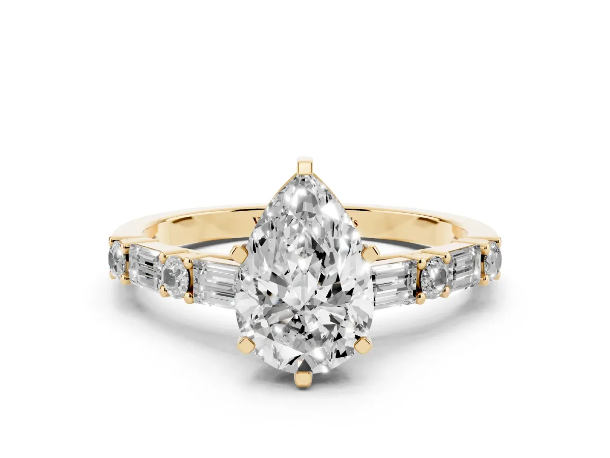 Pear Cut Diamond Solitaire with Side Baguettes and Channel Set Band Yellow gold