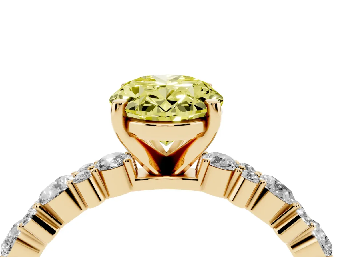 Fancy Yellow Oval Cut Diamond Side Stone Solitaire Ring with Round and Four-Prong Setting Yellow gold