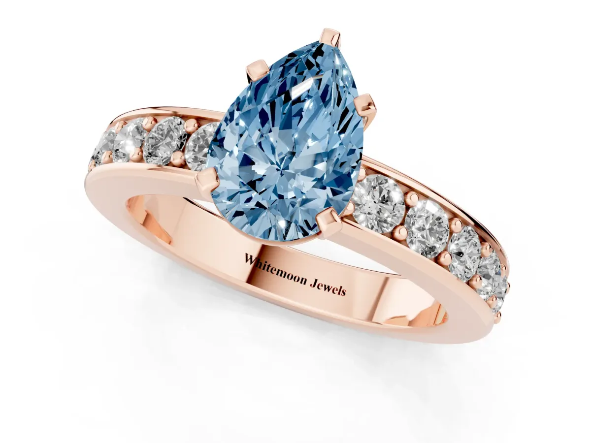 Fancy Blue Pear Cut Diamond Engagement Ring with Channel Set Round Band and Prong Setting Rose gold