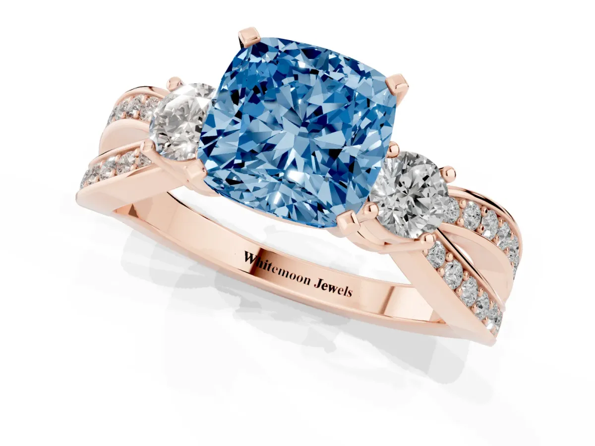 Fancy Blue Three-Stone Cushion Cut Cut Diamond Twist Band with Prong Setting Rose gold