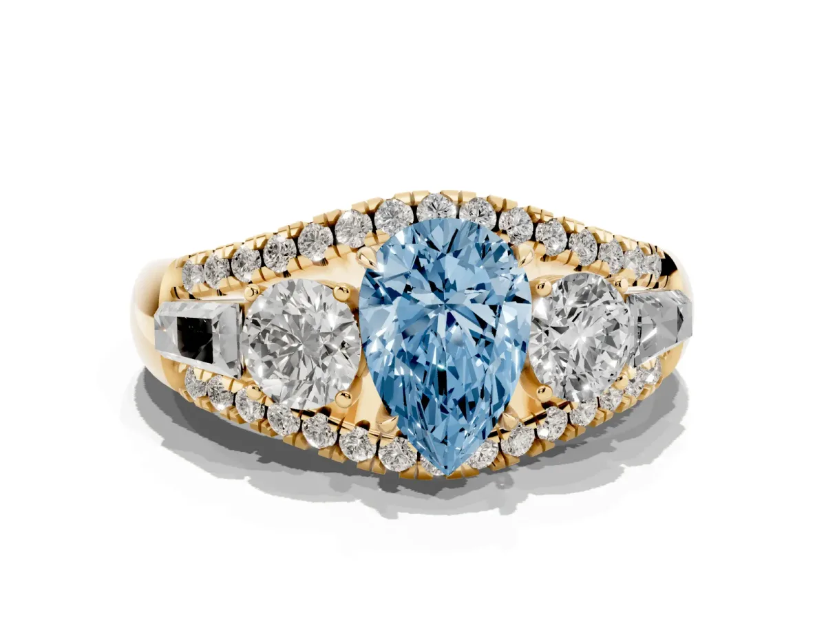 Fancy Blue Three-Stone Pear Cut Diamond Engagement Ring with Pave Band and Prong Setting Yellow gold