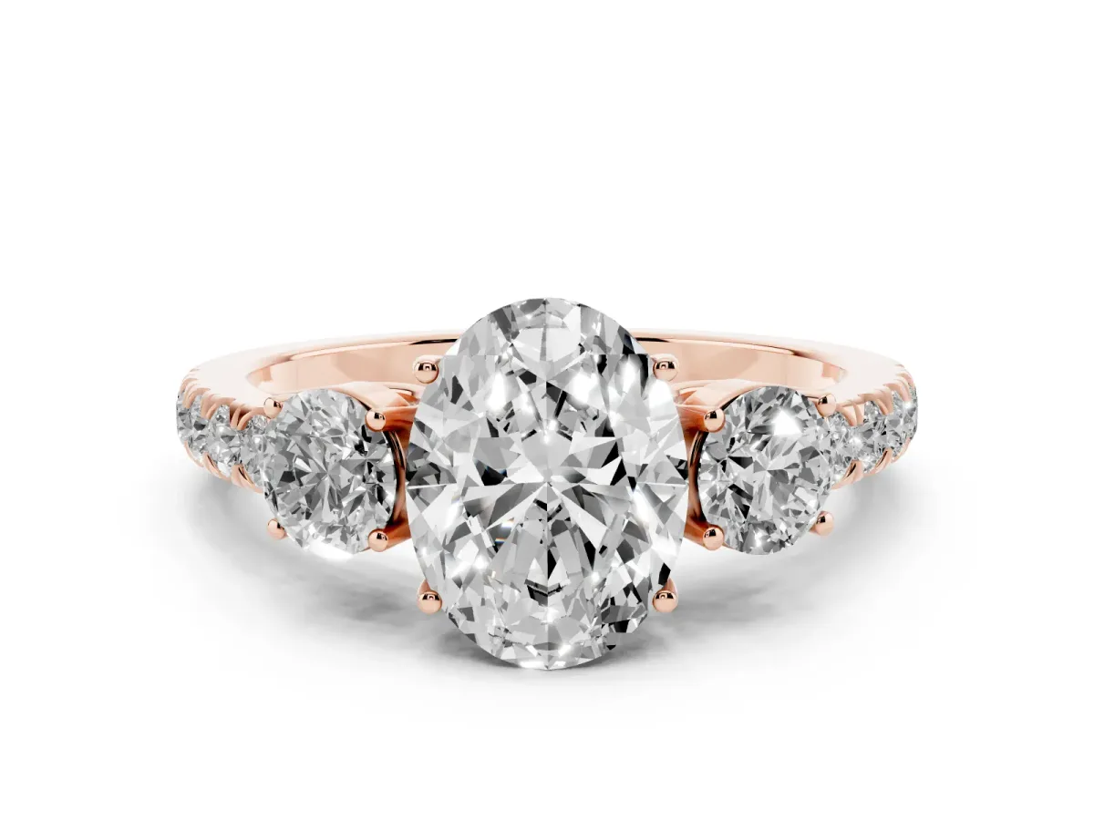 Oval Cut Cut Diamond Three-Stone Ring with Round Side Stones and Pavé Band Rose gold