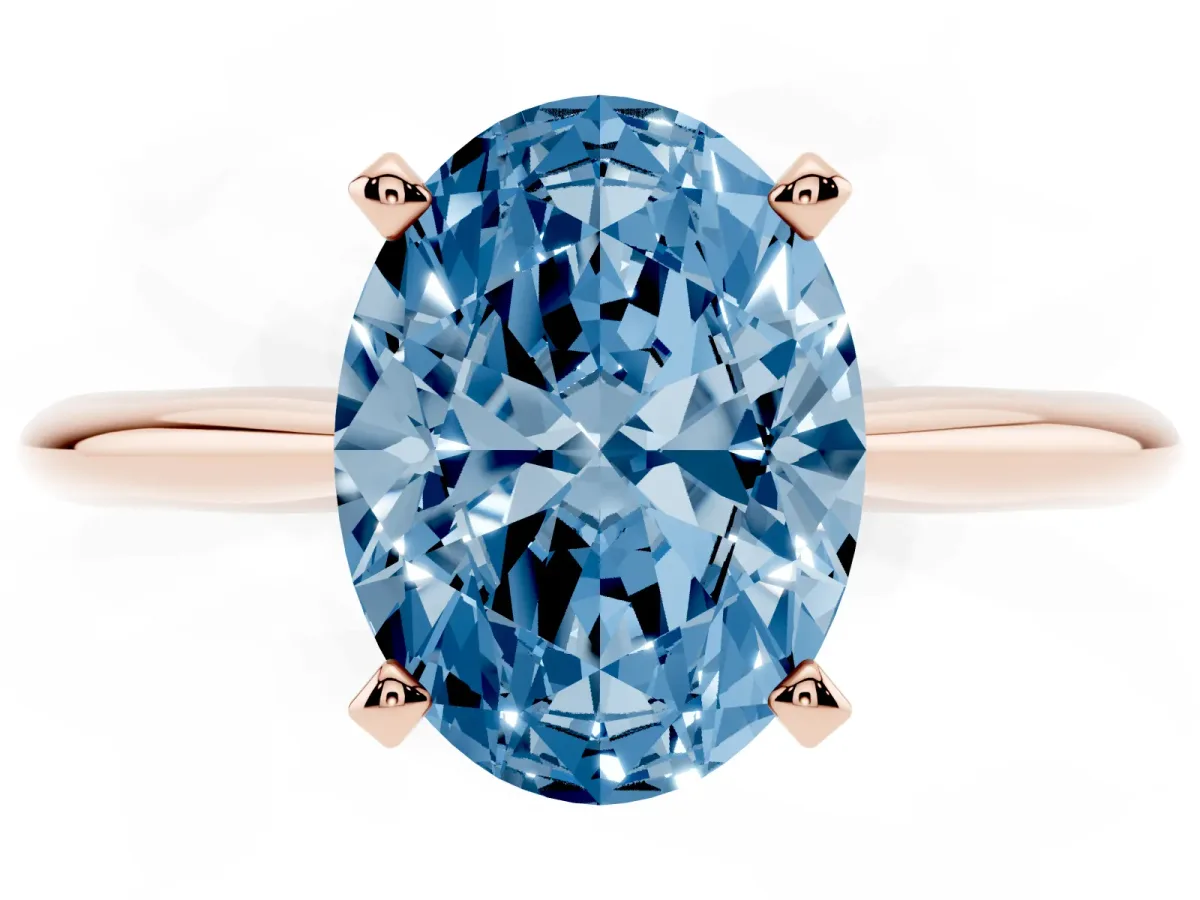 Fancy Blue Oval Cut Cut Solitaire Ring with Four-Prong Setting on a Classic Band Rose gold