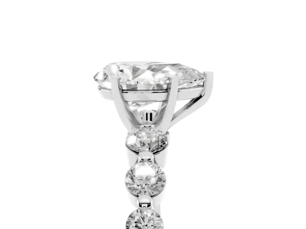 Pear Cut Solitaire Diamond Ring with Pave Band and Four-Prong Setting Silver
