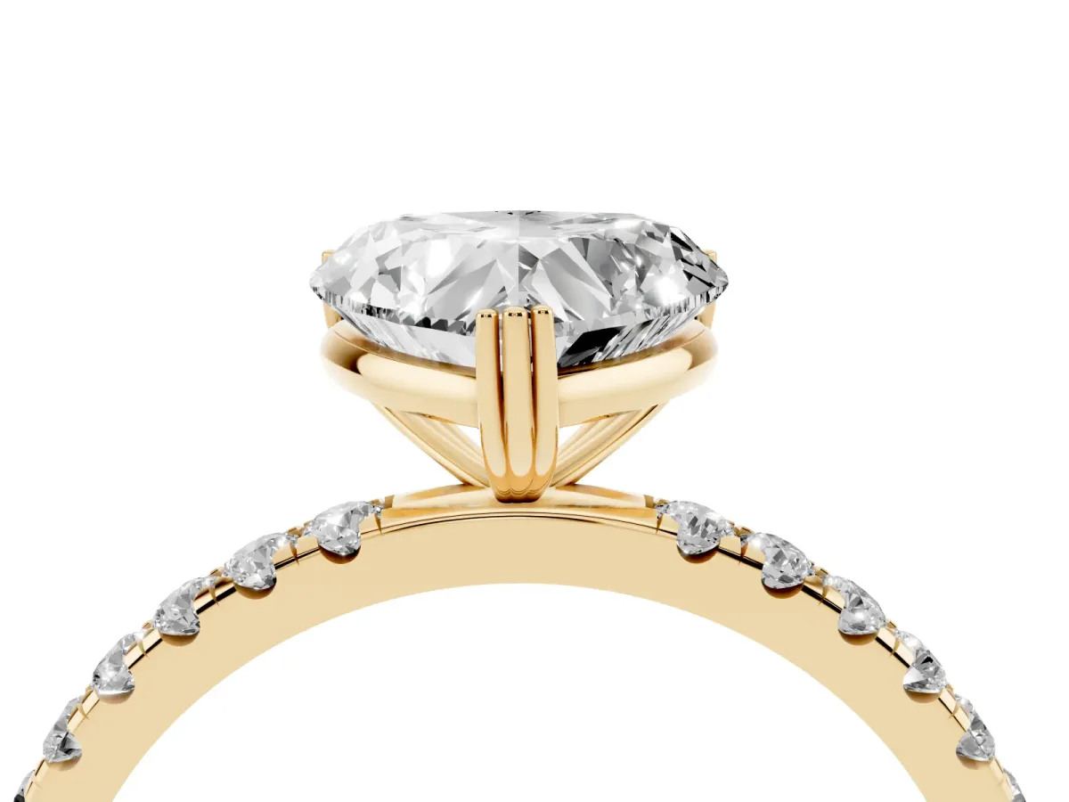 Heart Cut Brilliant Solitaire with Pavé Band and Claw Prong Setting Yellow gold