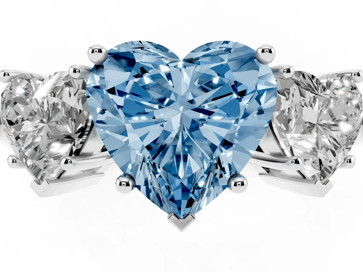 Fancy Blue Three-Stone Heart Cut Cut Diamond Engagement Ring with Prong Setting on a White Gold Band Platinum
