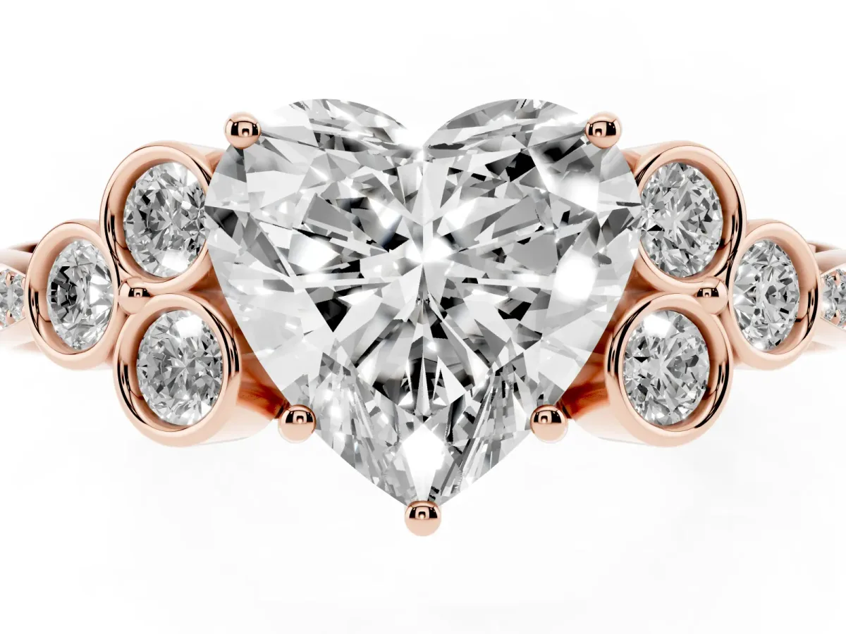 Heart Cut Cut Diamond Engagement Ring with Bezel Set Round Side Stones and Prong Setting Rose gold