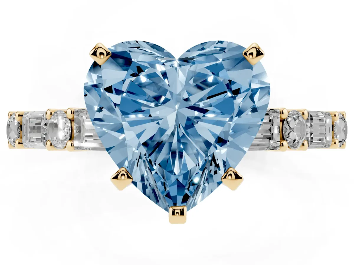 Fancy Blue Heart Cut Diamond Solitaire with Side Baguettes and Channel Set Band Yellow gold