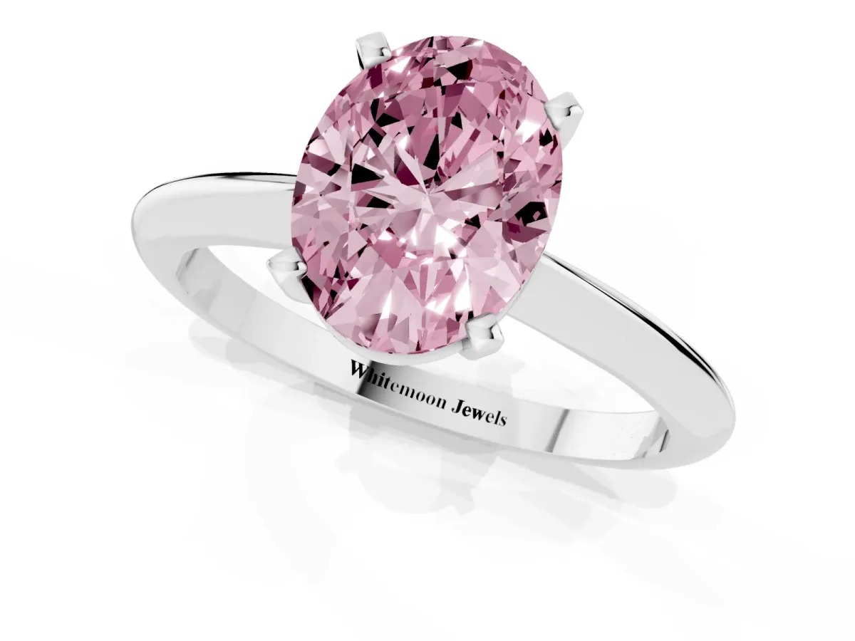 Fancy Pink Oval Cut Cut Solitaire Ring with Four-Prong Setting on a Classic Band Silver