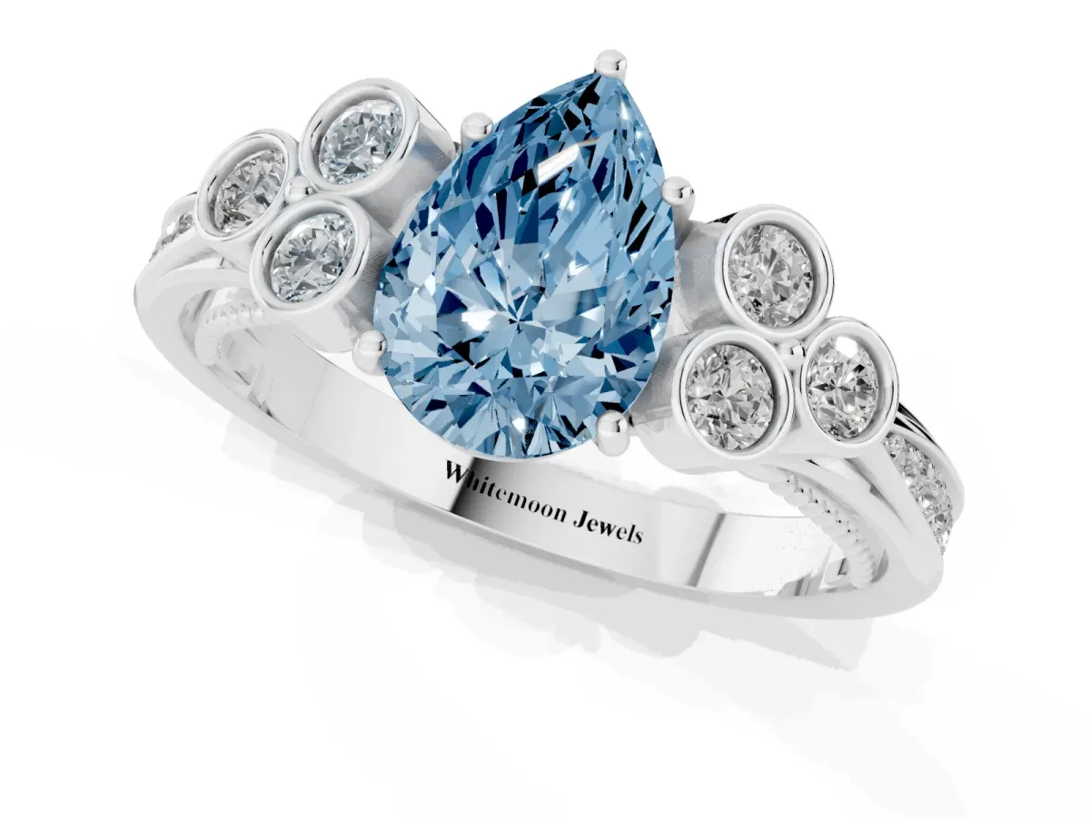 Fancy Blue Pear Cut Cut Diamond Engagement Ring with Bezel Set Round Side Stones and Prong Setting Silver
