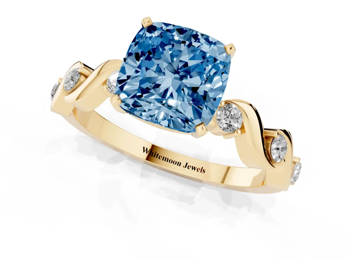 Fancy Blue Cushion Cut Diamond Solitaire Twisted Band with Round Accents and Prong Setting Yellow gold