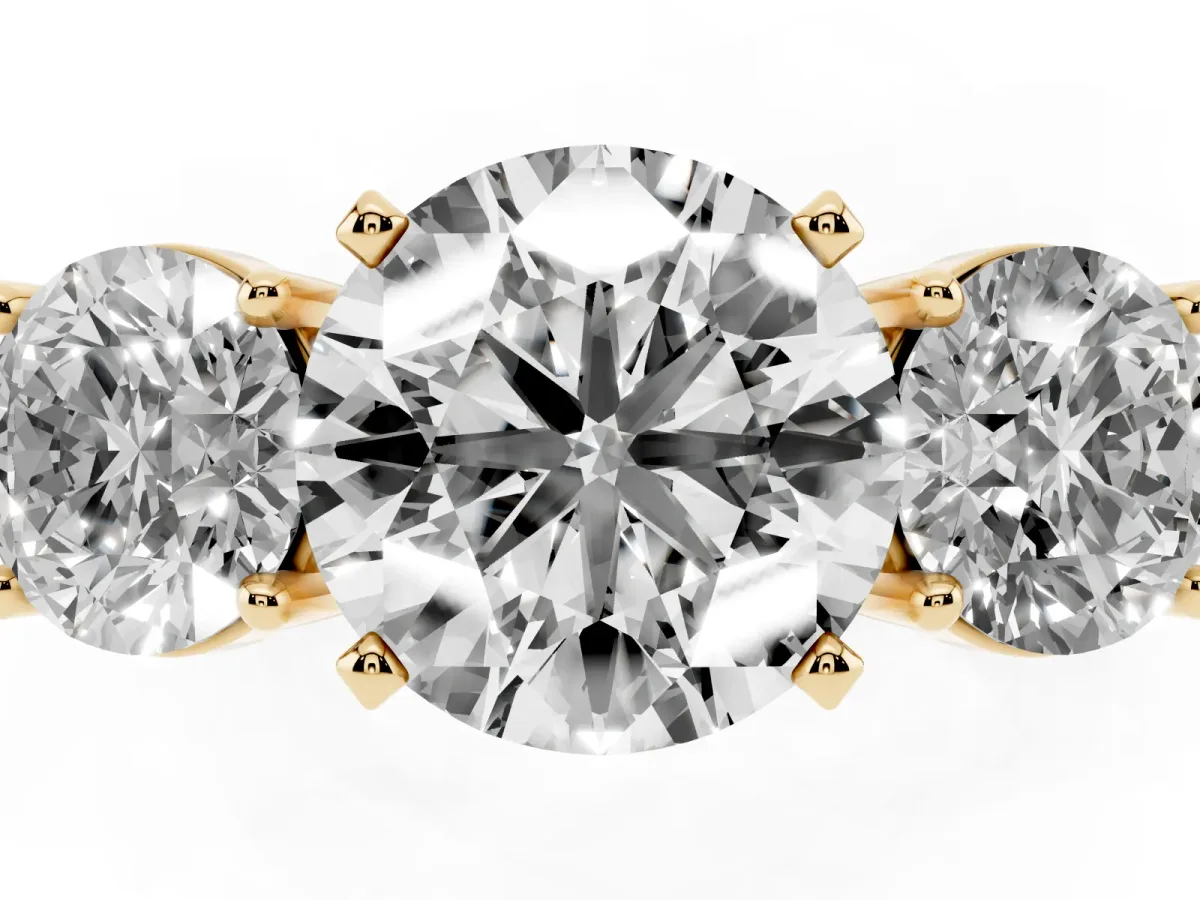 Three-Stone Round Cut Diamond Ring with Round Side Stones, Classic Band, and Four-Prong Setting Yellow gold