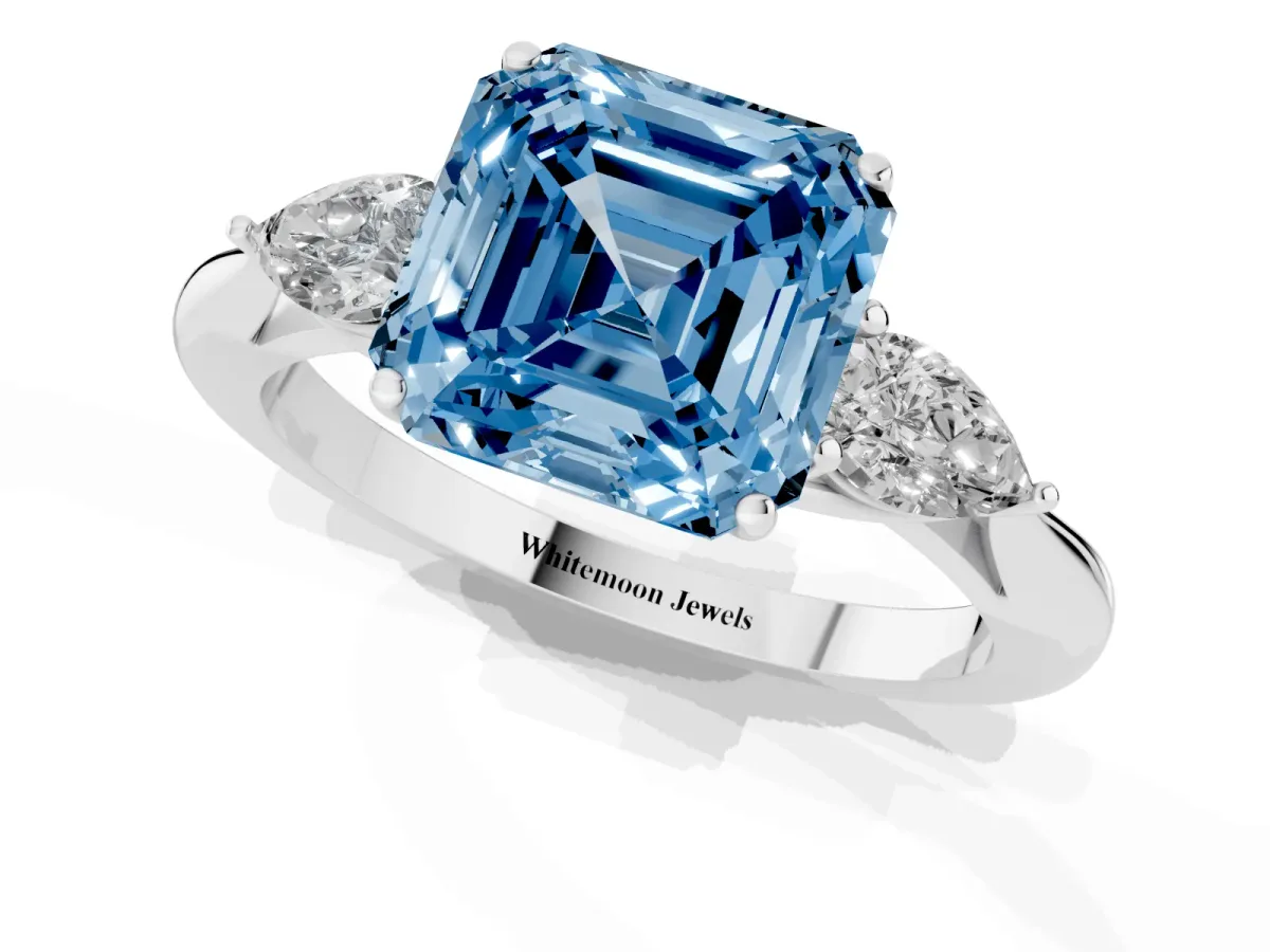 Fancy Blue Three-Stone Asscher Cut Diamond Ring with Pear Side Stones in Four-Prong Setting Silver