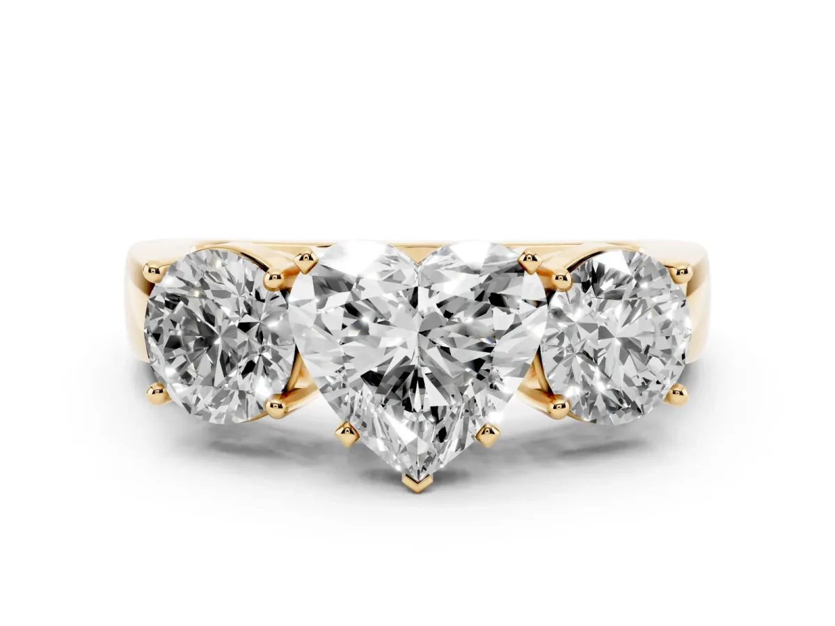 Three-Stone Heart Cut Diamond Ring with Round Side Stones, Classic Band, and Four-Prong Setting Yellow gold