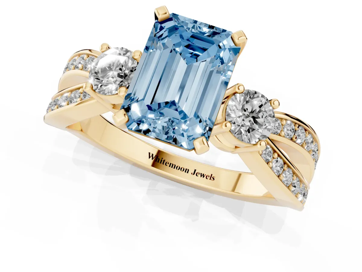 Fancy Blue Three-Stone Emerald Cut Cut Diamond Twist Band with Prong Setting Yellow gold