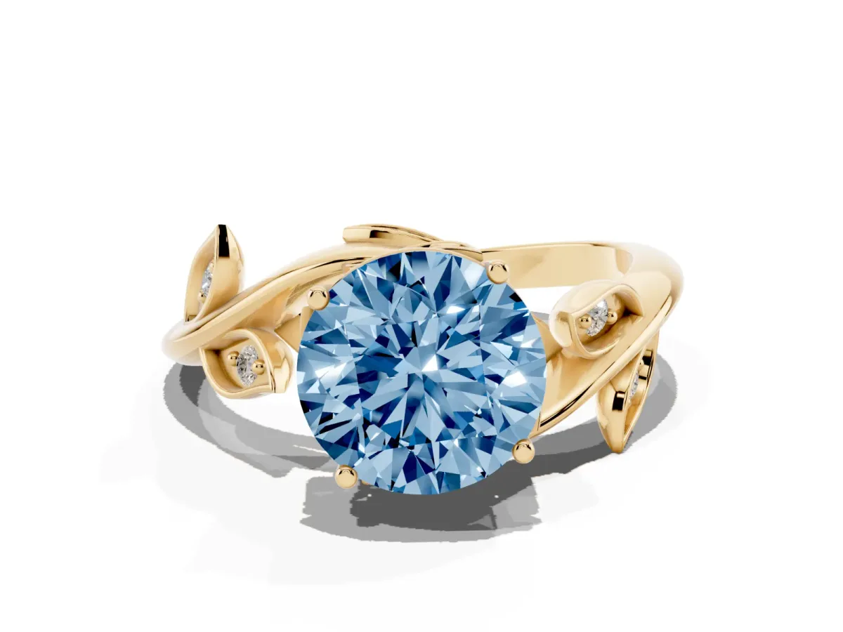Fancy Blue Round Cut Solitaire Twist Engagement Ring with Leaf Accents and Prong Setting Yellow gold