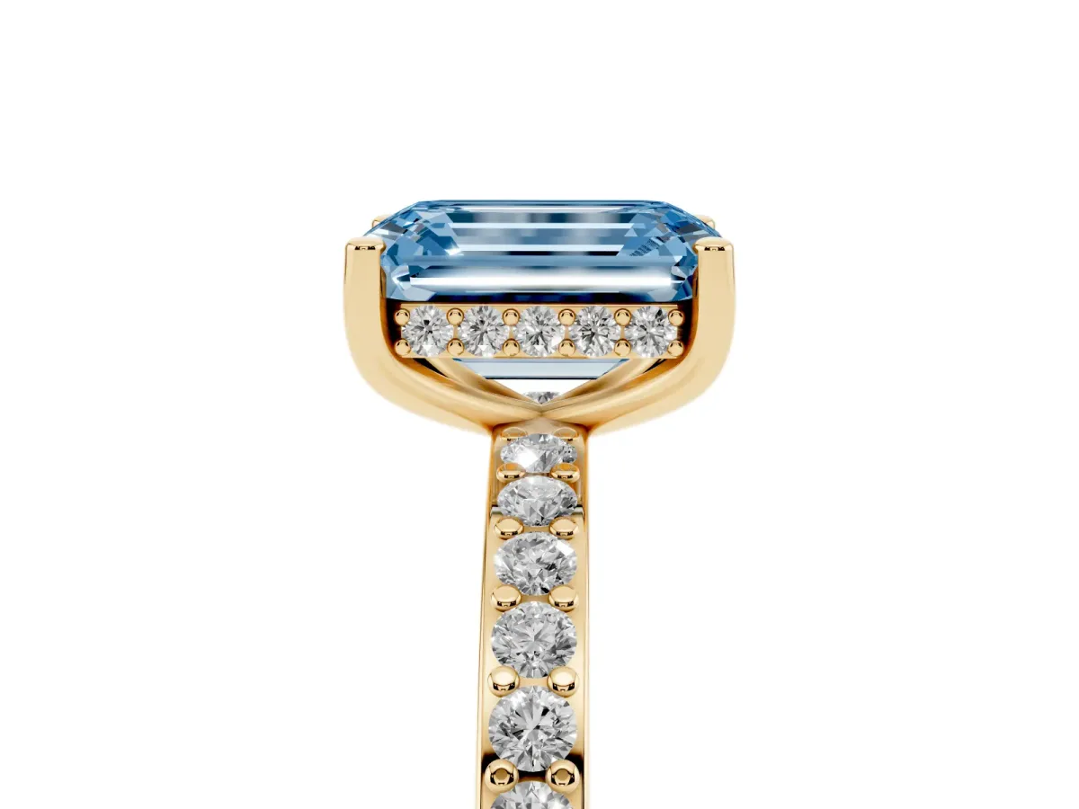Fancy Blue Emerald Cut Cut Diamond Pavé Band Ring with Four-Prong Setting Yellow gold