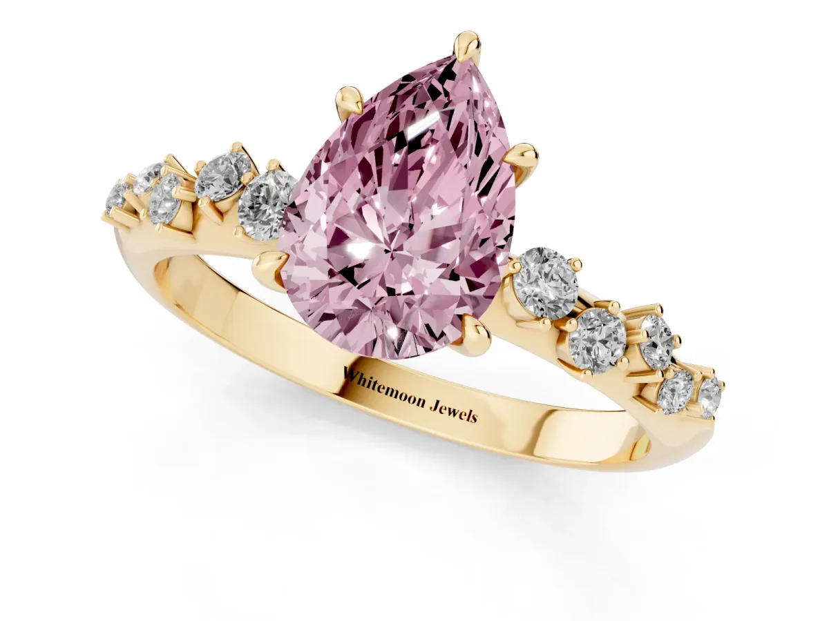 Fancy Pink Pear Cut Diamond Cluster Side Stone Solitaire Ring with Prong Setting Yellow gold