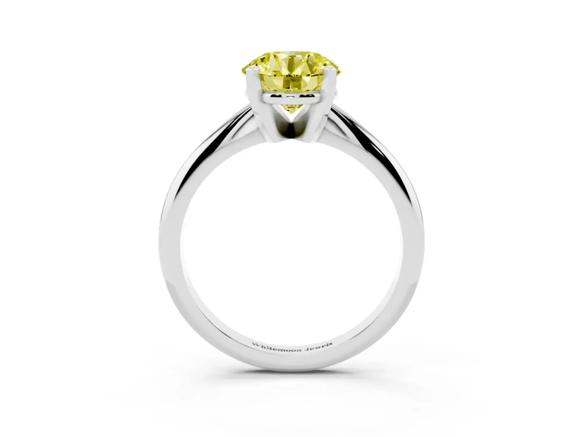 Fancy Yellow Round Cut Cut Solitaire Ring with Four-Prong Setting on a Classic Band Silver