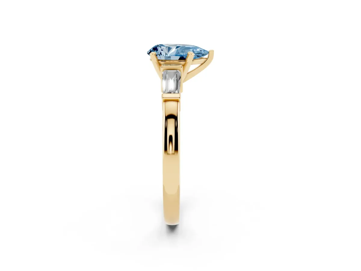 Fancy Blue Pear Cut Cut Diamond Solitaire Ring with Tapered Baguette Accents and Four-Prong Setting Yellow gold