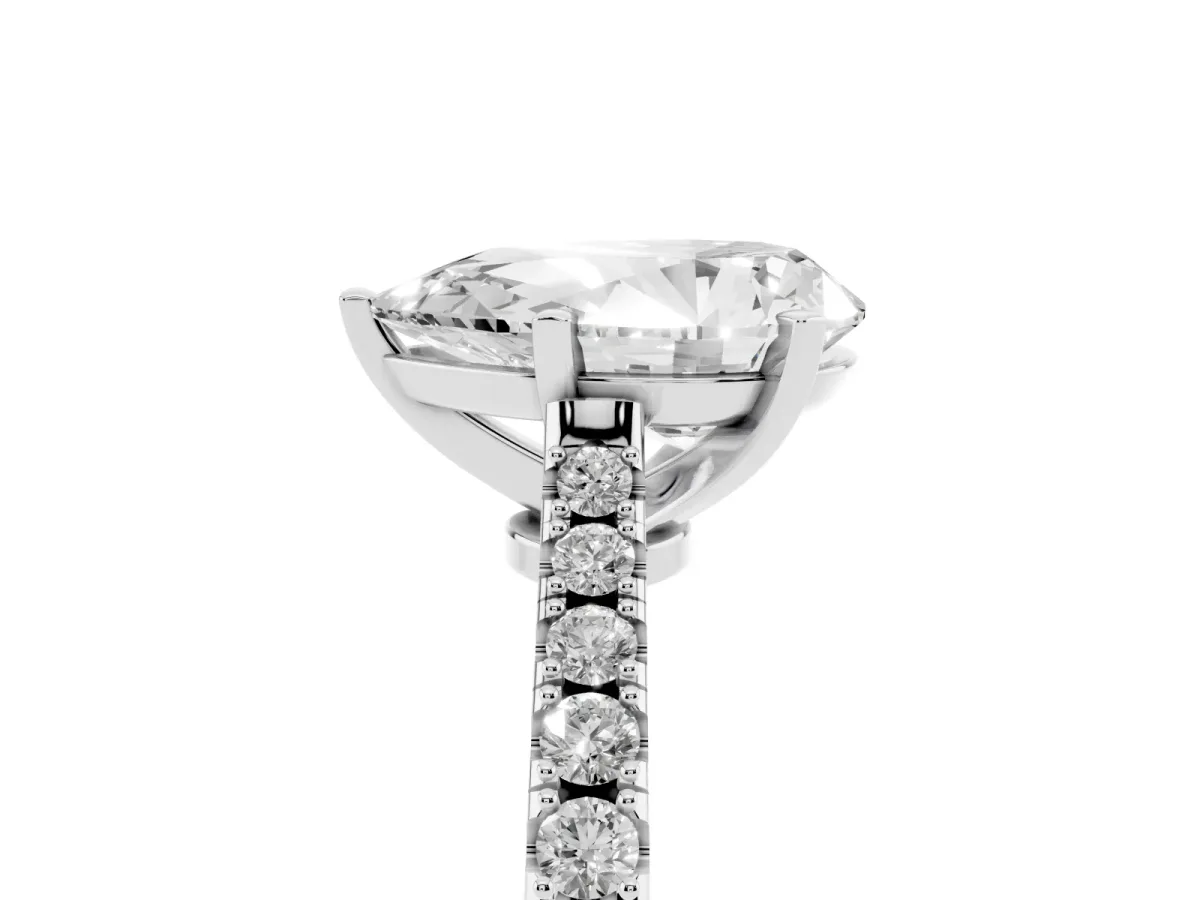 Pear Cut Cut Solitaire Diamond Engagement Ring with Pave Band and Four-Prong Setting Platinum