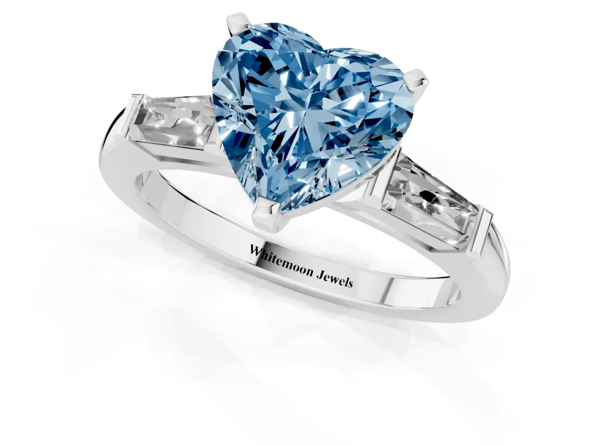 Fancy Blue Heart Cut Solitaire with Tapered Baguette Side Stones on a Classic Band with Four-Prong Setting White gold