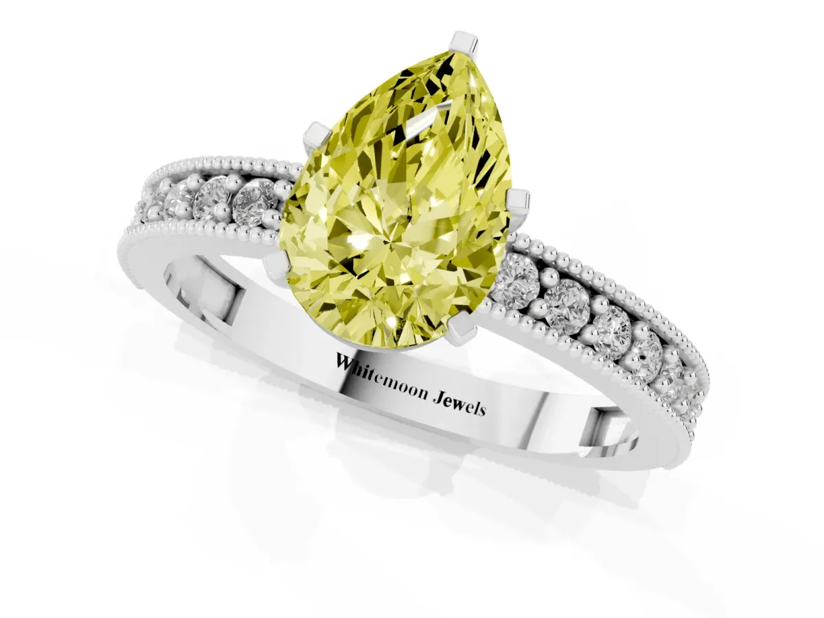 Fancy Yellow Pear Cut Diamond Milgrain Pavé Engagement Ring with Four-Prong Setting Silver