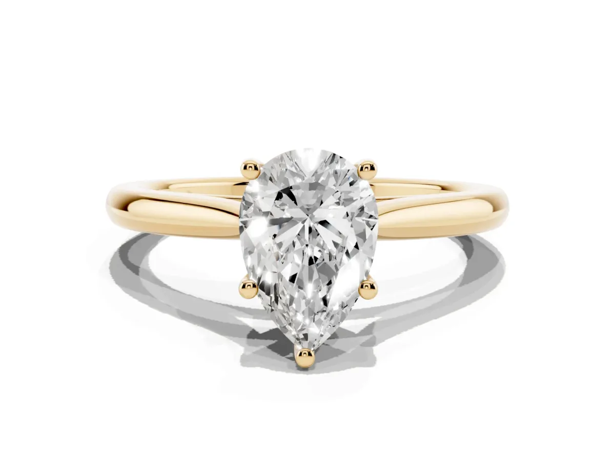 Pear Cut Cut Solitaire Ring with Cathedral Band and Four-Prong Setting Yellow gold