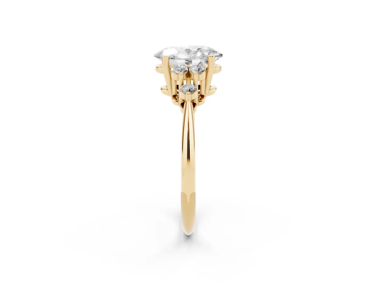 Oval Cut Cut Diamond Cluster Ring with Solitaire Band and Four-Prong Setting Yellow gold