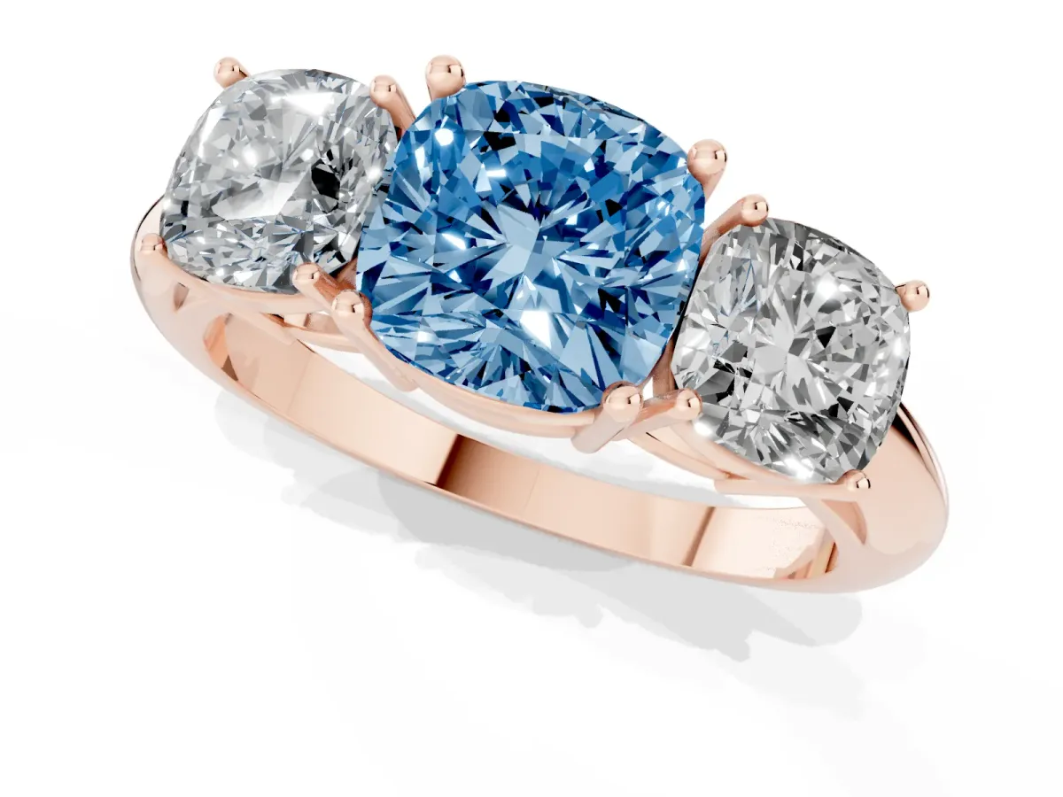 Fancy Blue Three-Stone Cushion Cut Cut Diamond Engagement Ring with Prong Setting on a White Gold Band Rose gold