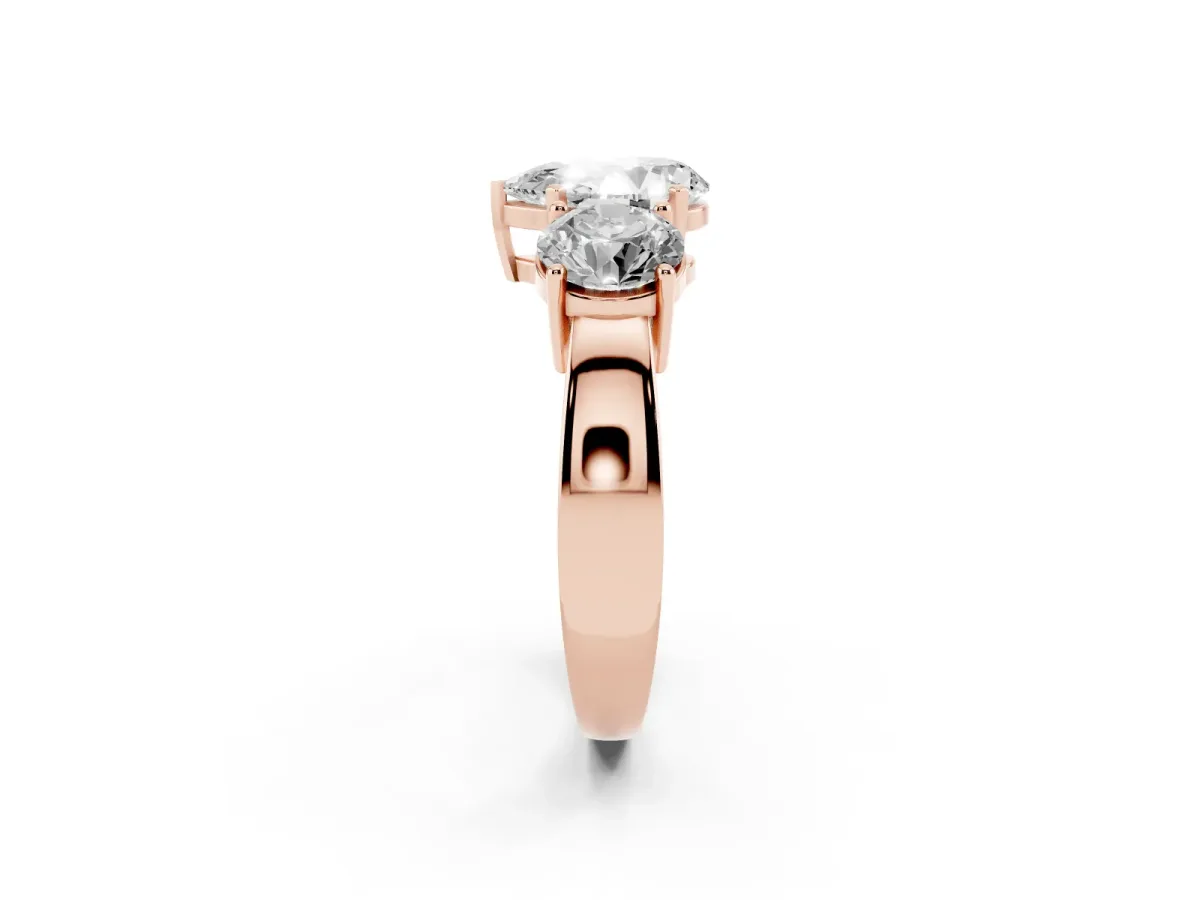 Three-Stone Pear Cut Diamond Ring with Round Side Stones, Classic Band, and Four-Prong Setting Rose gold