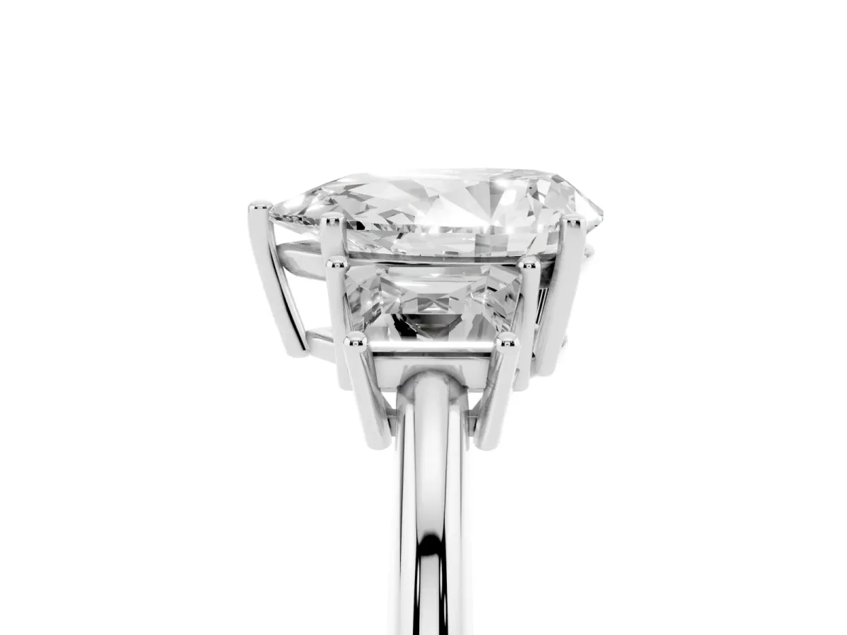 Pear Cut Diamond Three-Stone Ring with Trapezoid Side Stones and Prong Setting Platinum
