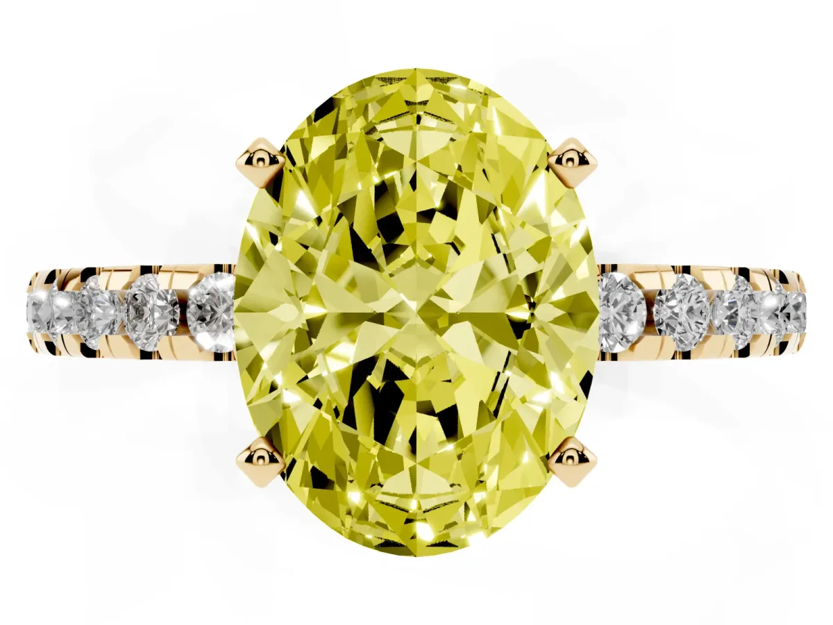Fancy Yellow Oval Cut Diamond Solitaire Ring with Round Pavé Band and Four-Prong Setting Yellow gold