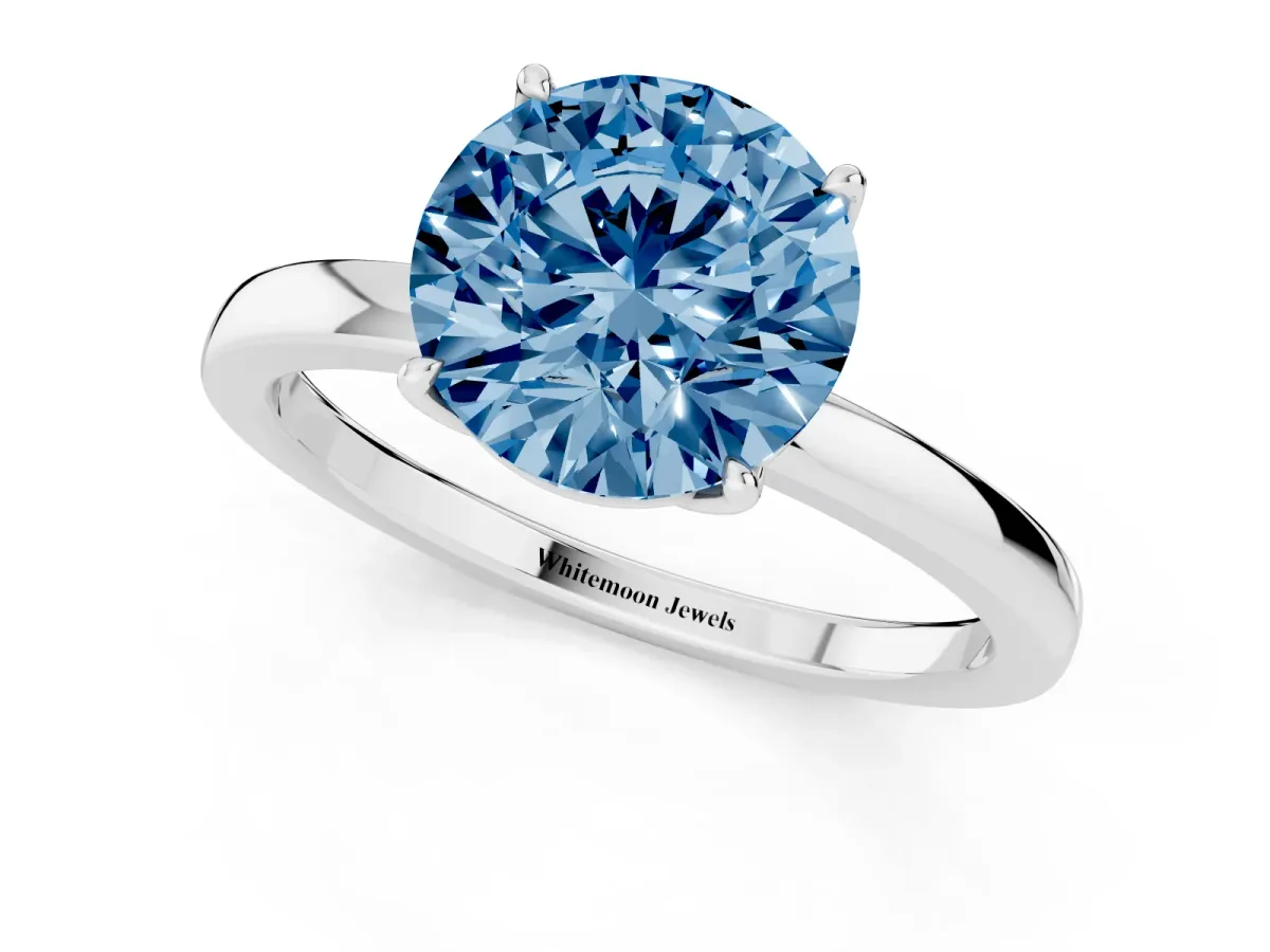 Fancy Blue Round Cut Diamond Solitaire Ring with Thin Band and Prong Setting Silver