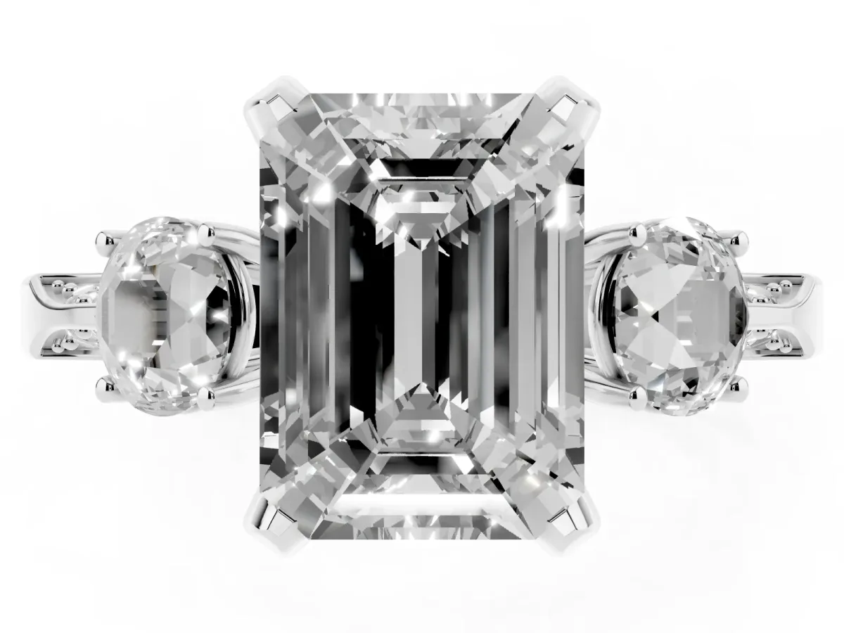 Fancy Pink Emerald Cut Brilliant Three-Stone Diamond Ring with Pavé Band and Four-Prong Setting White gold