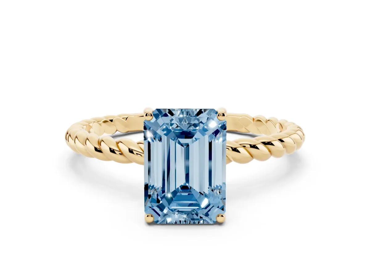 Fancy Blue Emerald Cut Solitaire Twist Band Ring with Four-Prong Setting Yellow gold