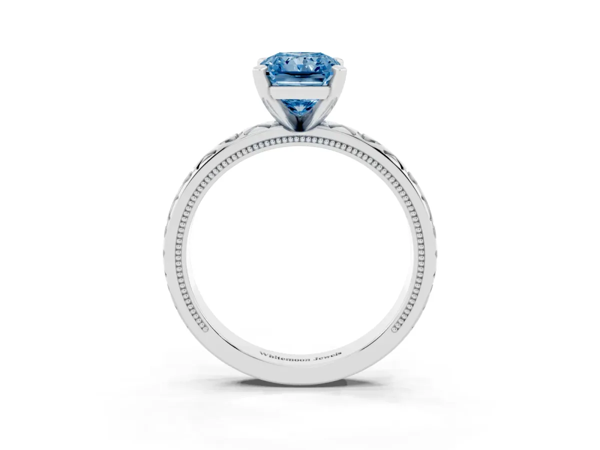 Fancy Blue Radiant Cut Solitaire Diamond Engagement Ring with XO Engraved Band and Four-Prong Setting Silver
