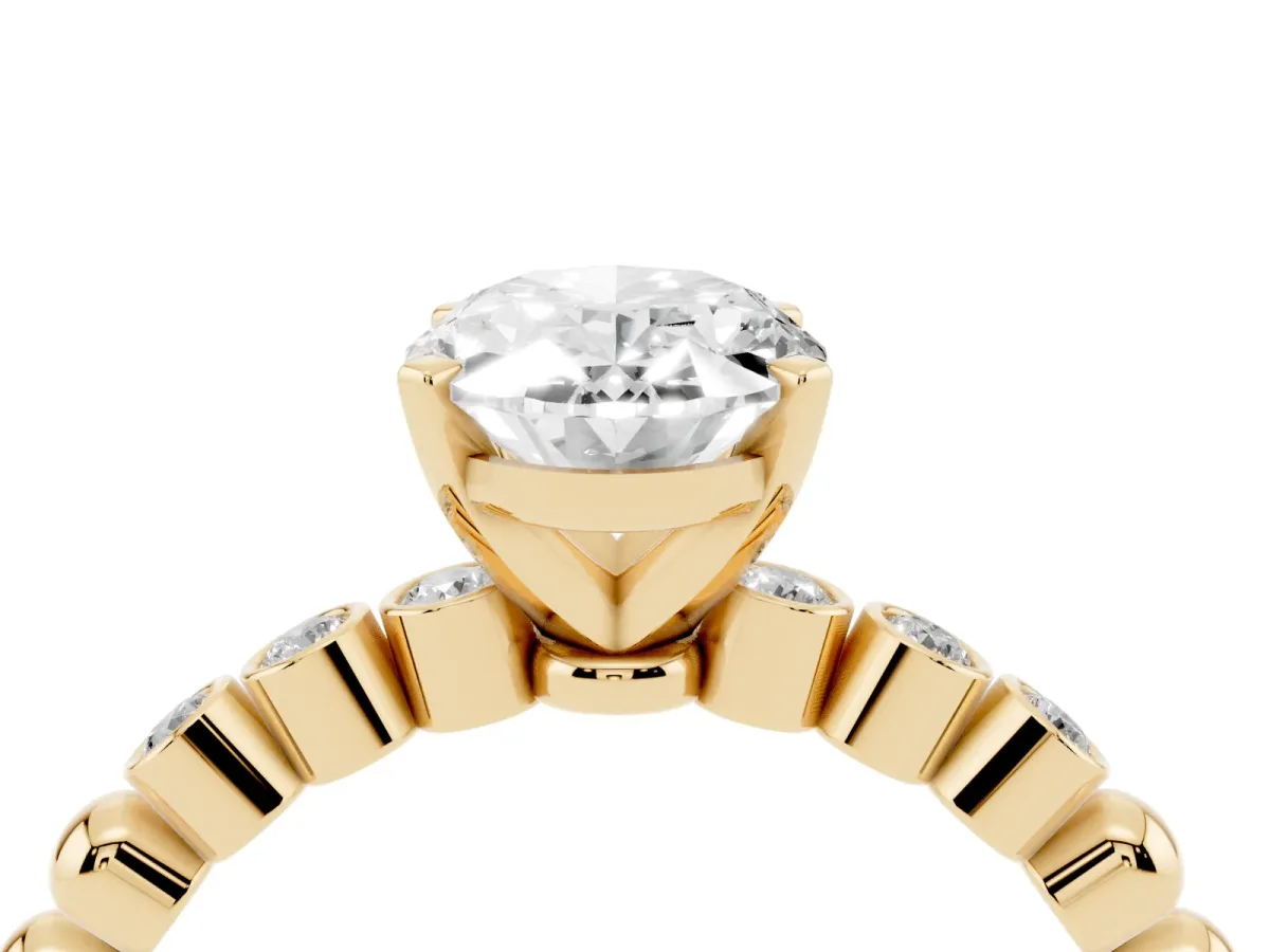 Oval Cut Solitaire Bezel Accent Diamond Engagement Ring with Beaded Band and Four-Prong Setting Yellow gold