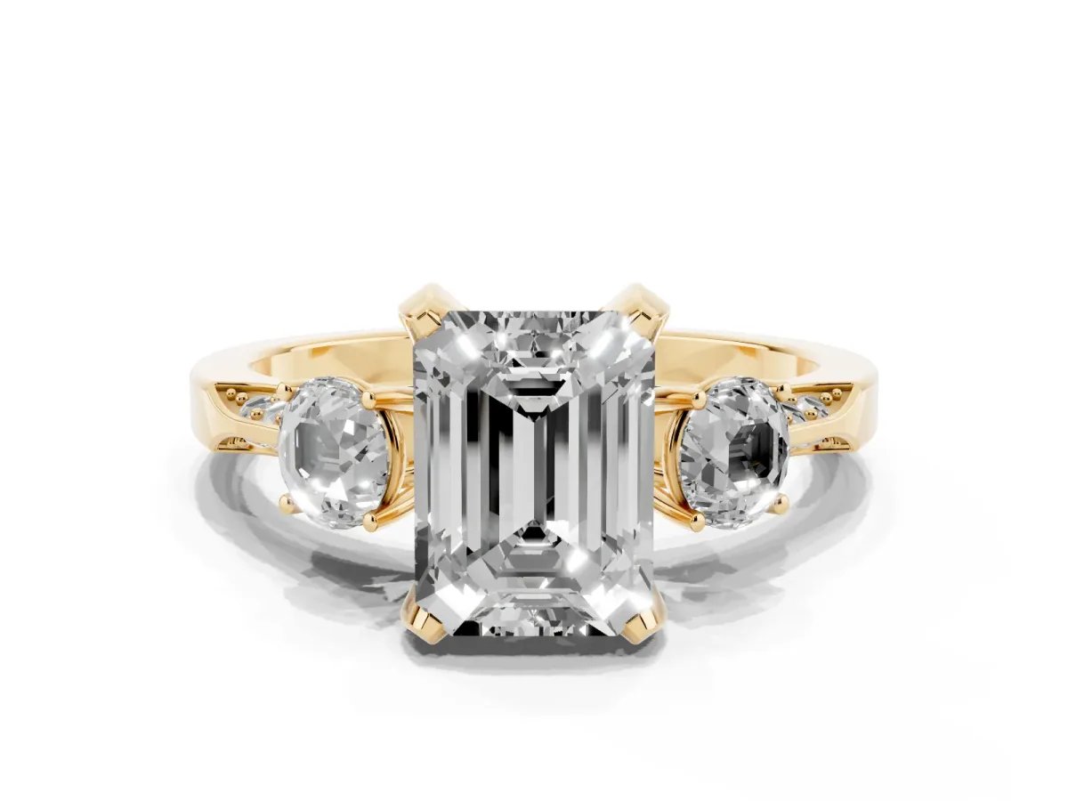 Emerald Cut Brilliant Three-Stone Diamond Ring with Pavé Band and Four-Prong Setting Yellow gold
