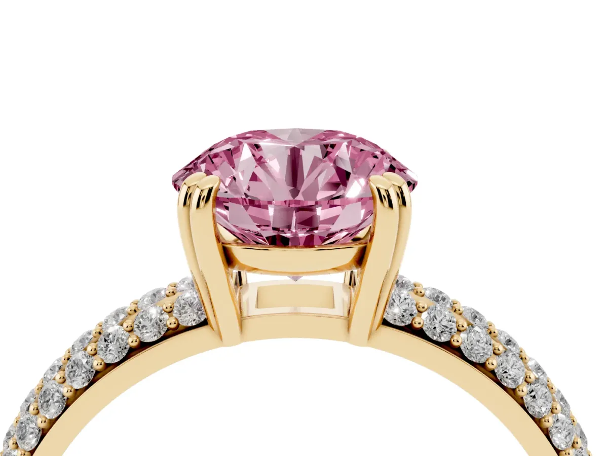 Fancy Pink Round Cut Diamond Solitaire Ring with Multi-Row Round Pavé Band and Prong Setting Yellow gold