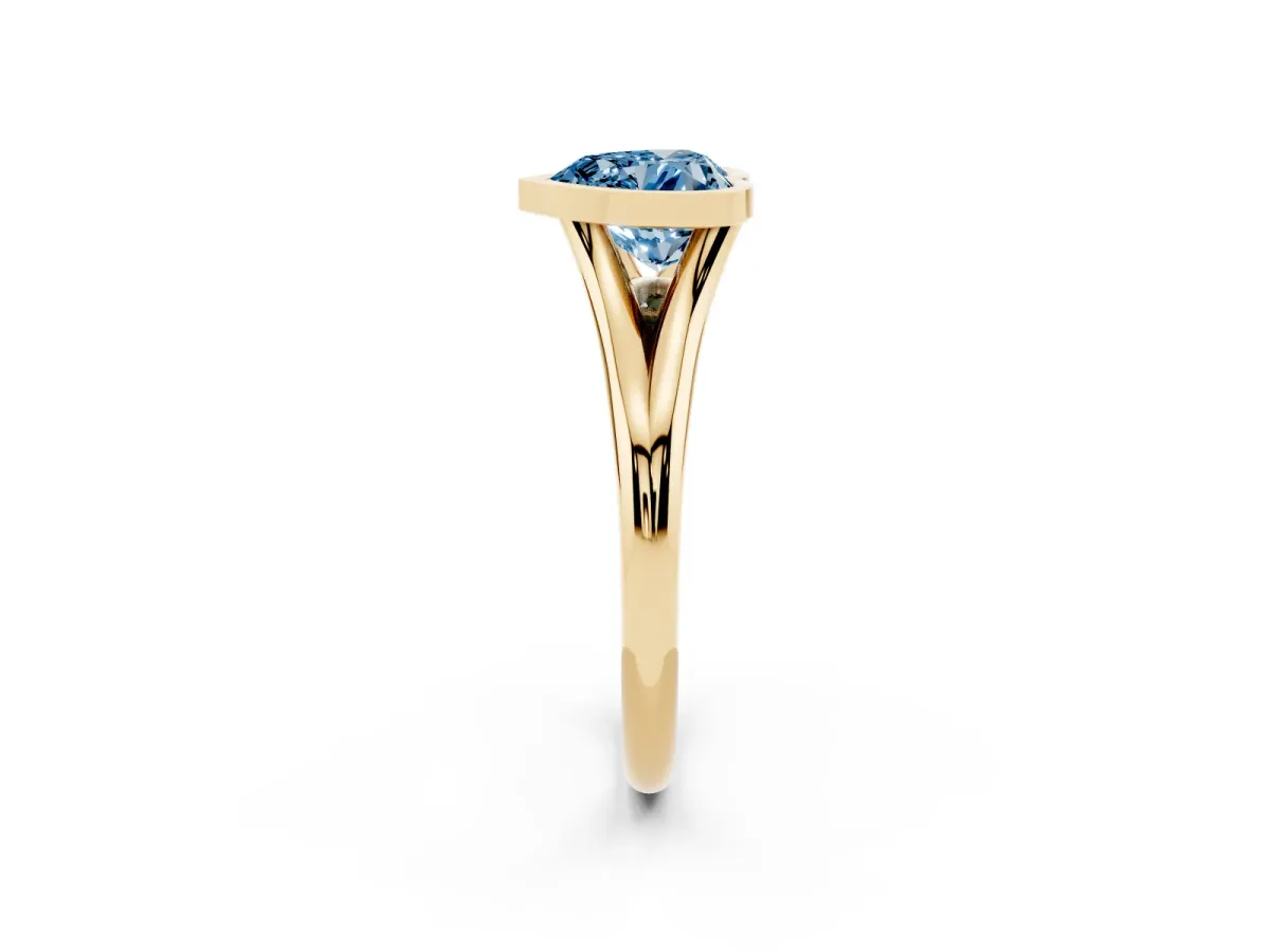 Fancy Blue Bezel Set Heart Cut Cut Solitaire Ring with Tapered Band Yellow gold