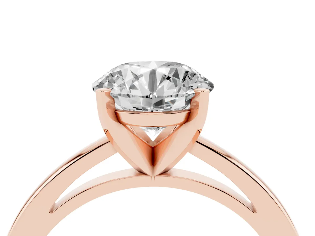 Round Cut Solitaire Diamond Engagement Ring with Four-Prong Setting on a Classic Band Rose gold